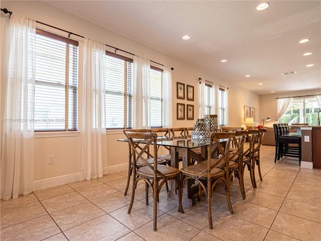 a view of a dining area with furniture and a window