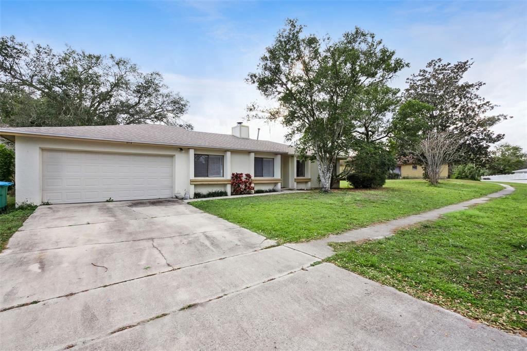 a front view of house with yard and green space