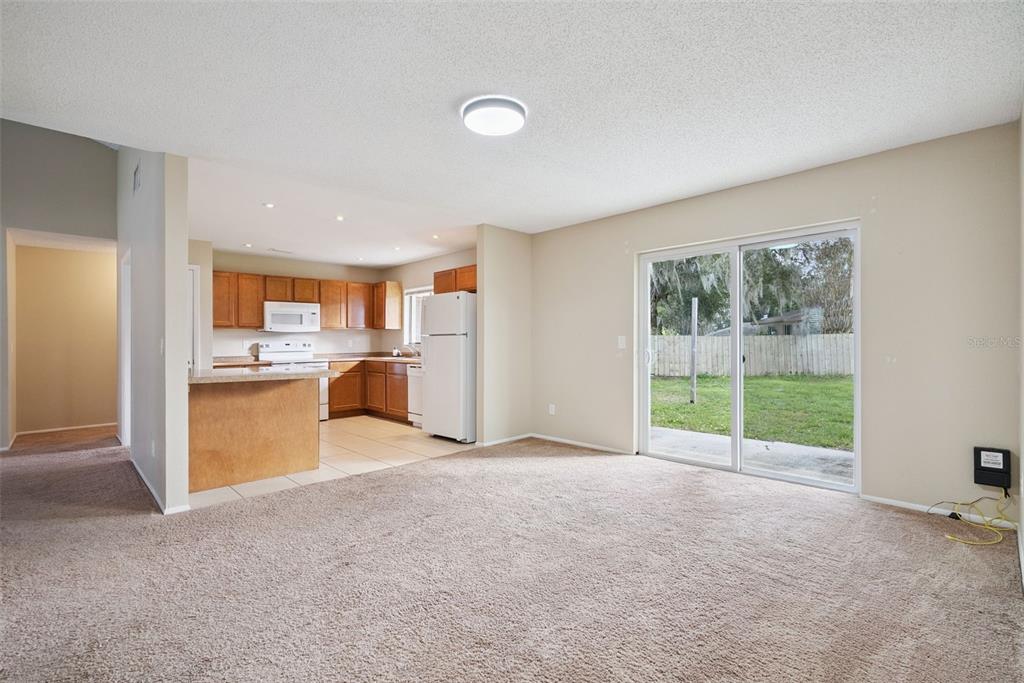 505 Tiberon Cove Road Longwood, FL 32750 - Photo 7 of 20 a view of a kitchen with furniture and a kitchen