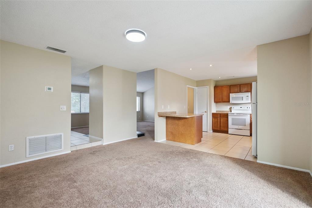 505 Tiberon Cove Road Longwood, FL 32750 - Photo 8 of 20 a view of a kitchen with a sink and a refrigerator