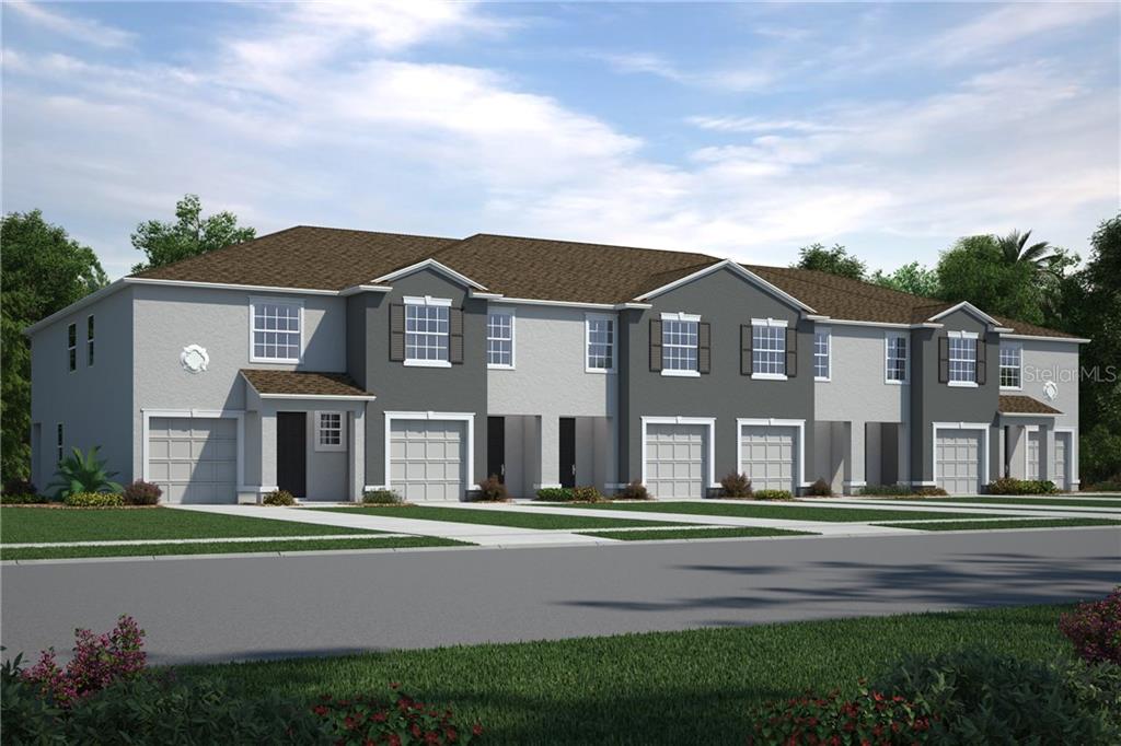 8835 Indigo Trail Loop Riverview, FL 33578 - Photo 1 of 1 a front view of a house with a garden