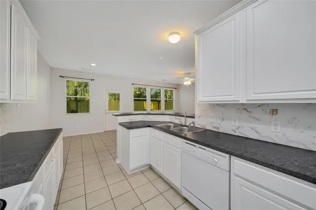 a kitchen with a sink and cabinets