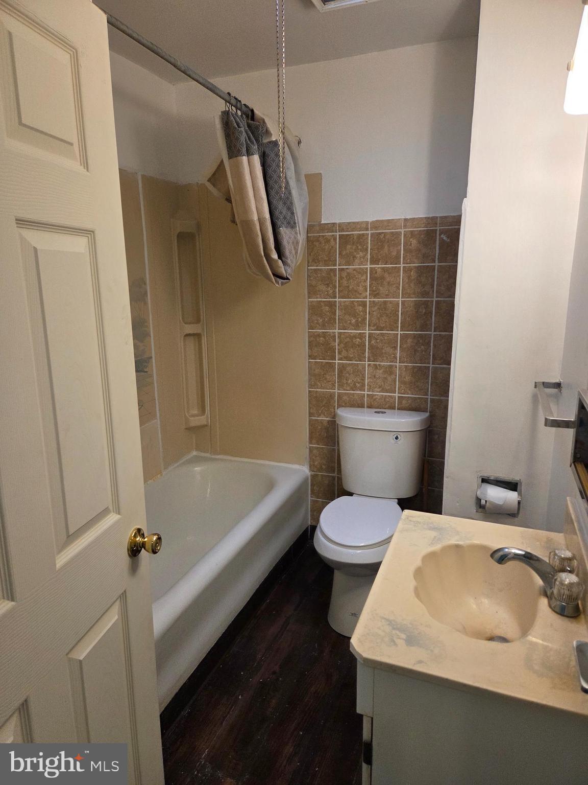 2014 South 68th Street Philadelphia, PA 19142 - Photo 7 of 9 a bathroom with a sink a toilet and shower