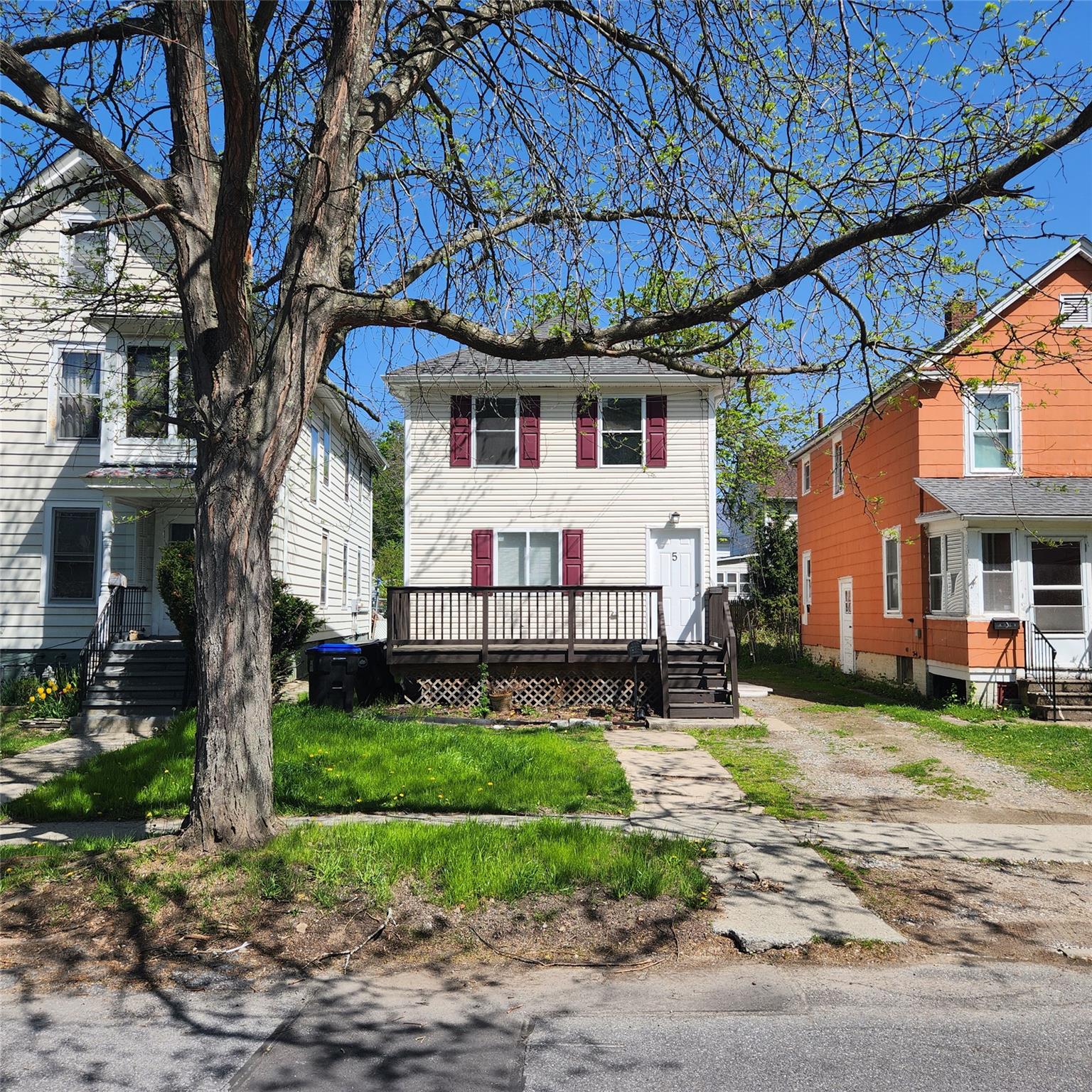 View of front of home with a wooden deck