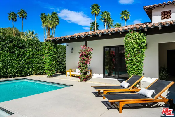 swimming pool with outdoor seating