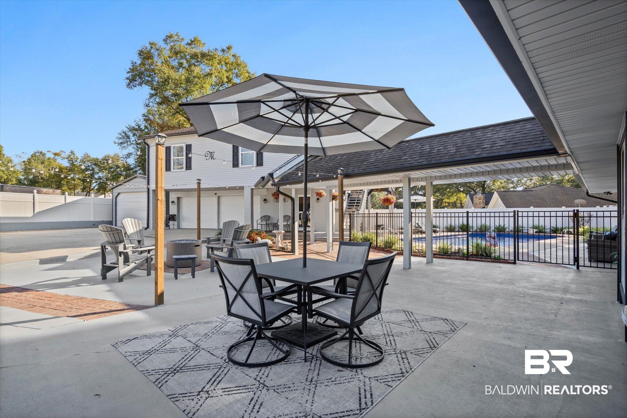 4567 Pine Avenue Saraland, AL 36571 - Photo 40 of 48 Fenced backyard featuring outdoor dining area, a patio, and a fire pit