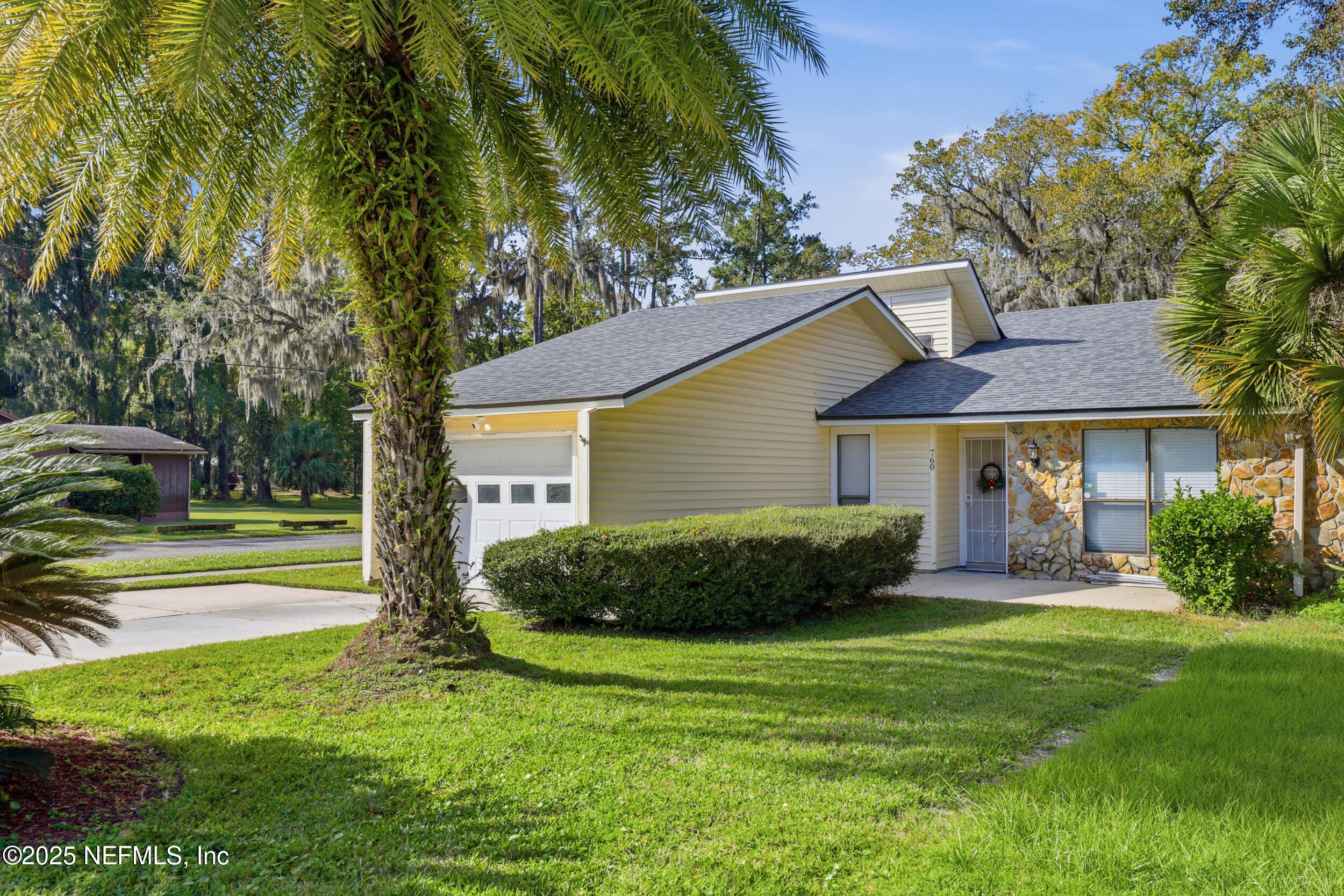 760 Plainfield Avenue Orange Park, FL 32073 - Photo 11 of 38 a front view of a house with a yard