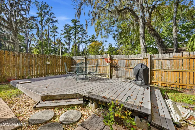 a view of wooden floor and windows in a room