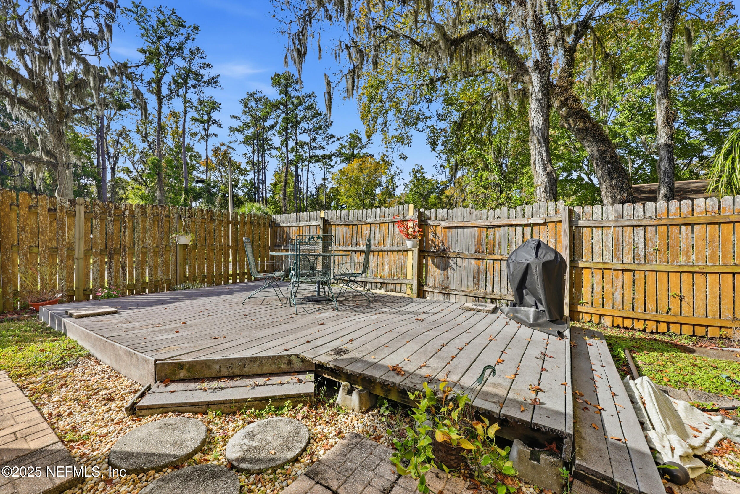760 Plainfield Avenue Orange Park, FL 32073 - Photo 17 of 38 a view of a wooden deck with a patio