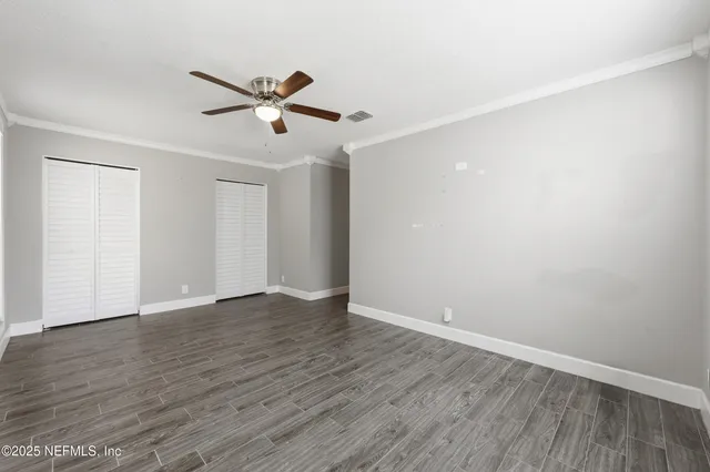 a view of a livingroom with wooden floor a fireplace