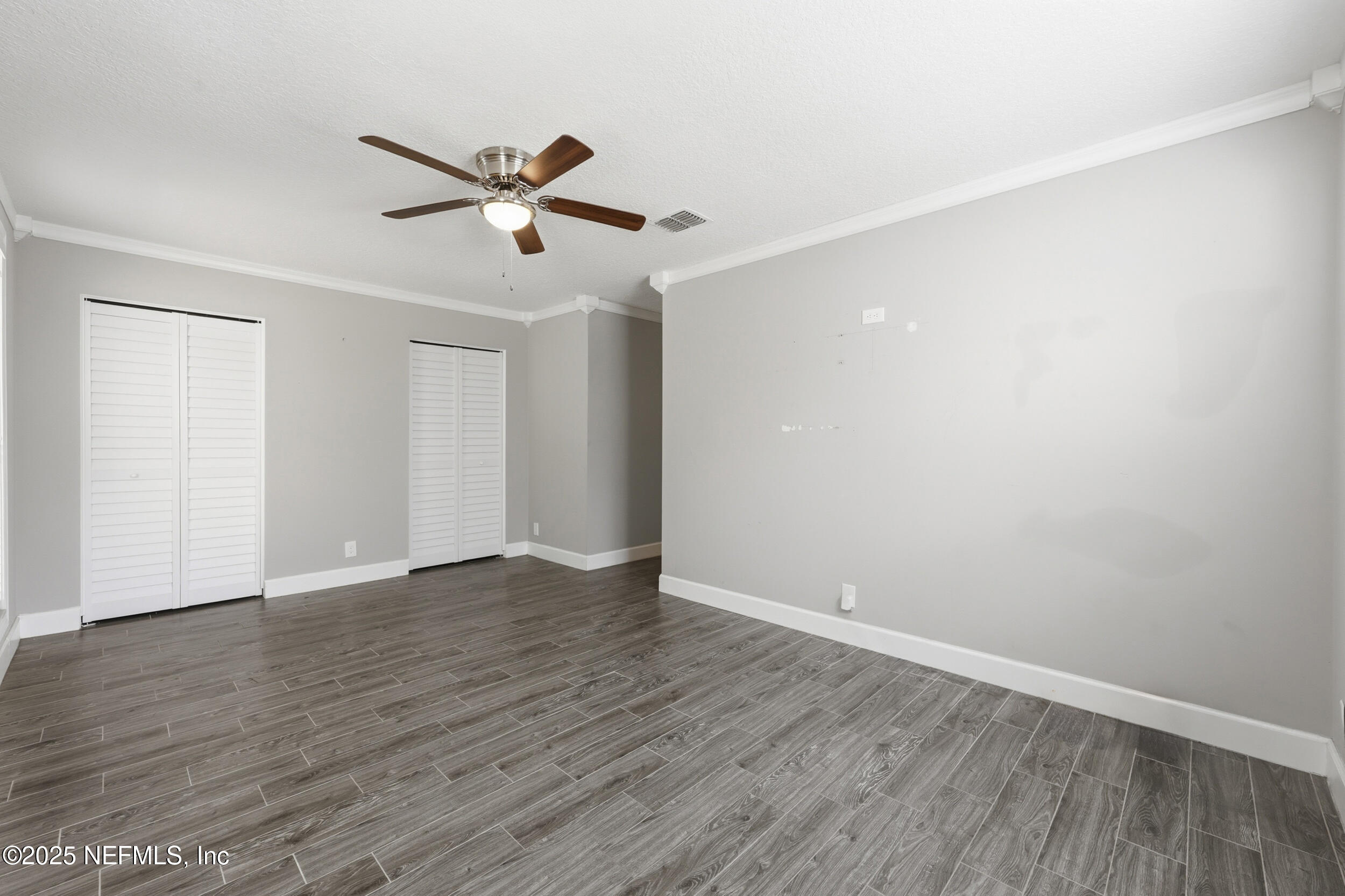 760 Plainfield Avenue Orange Park, FL 32073 - Photo 22 of 38 a view of an empty room with wooden floor
