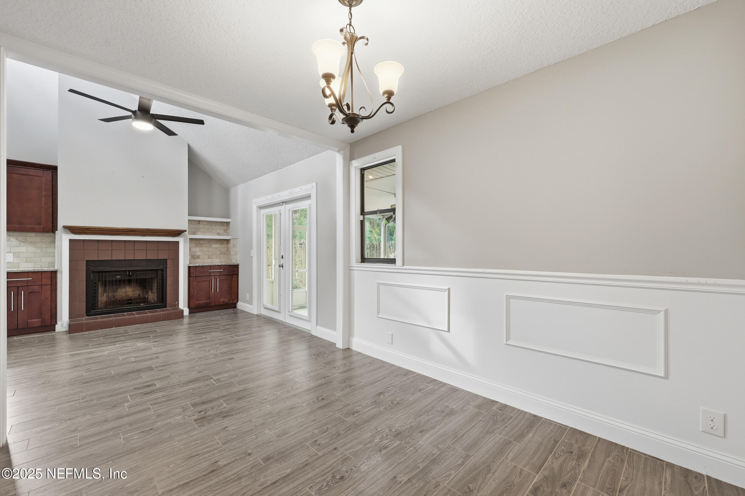 760 Plainfield Avenue Orange Park, FL 32073 - Photo 24 of 38 a view of a livingroom with wooden floor a fireplace