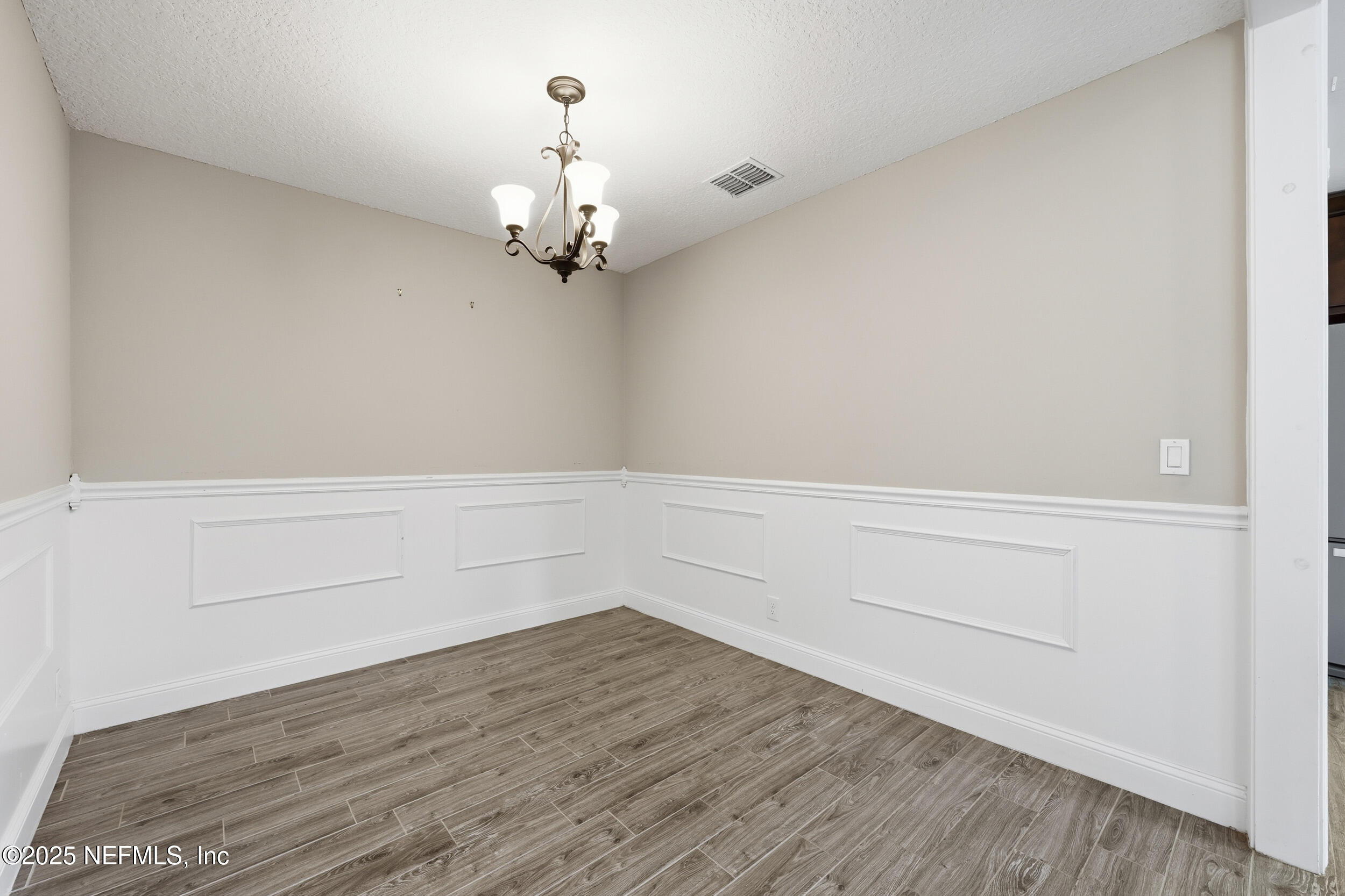 760 Plainfield Avenue Orange Park, FL 32073 - Photo 25 of 38 a view of a room with wooden floor and ceiling fan