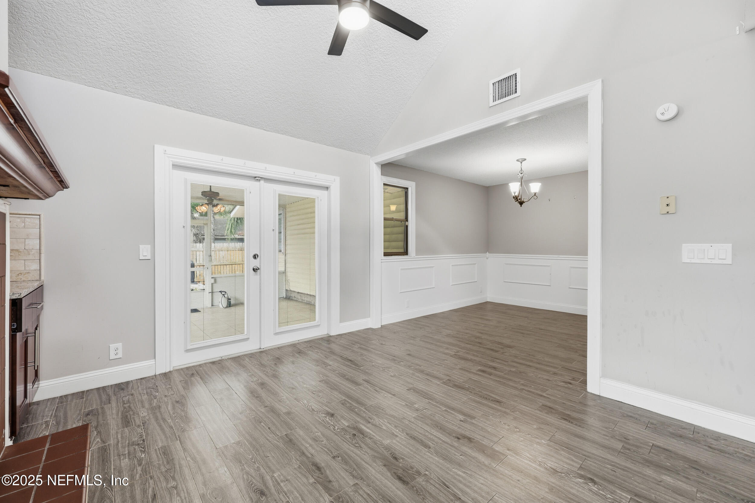 760 Plainfield Avenue Orange Park, FL 32073 - Photo 27 of 38 wooden floor in an empty room with a window