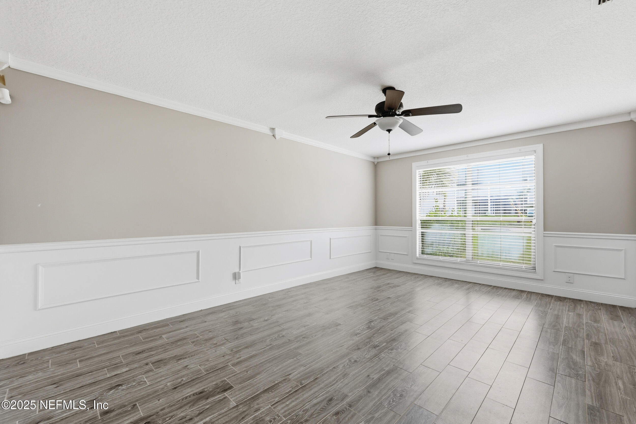 760 Plainfield Avenue Orange Park, FL 32073 - Photo 32 of 38 wooden floor in an empty room with a window
