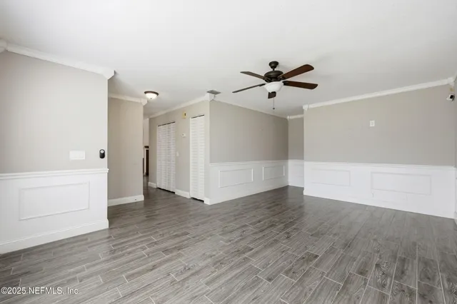 a view of hallway with wooden floor