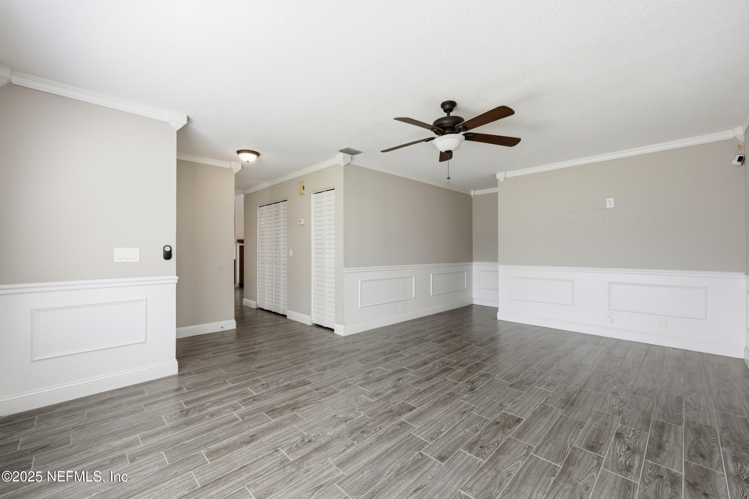 760 Plainfield Avenue Orange Park, FL 32073 - Photo 34 of 38 an empty room with wooden floor and ceiling fan