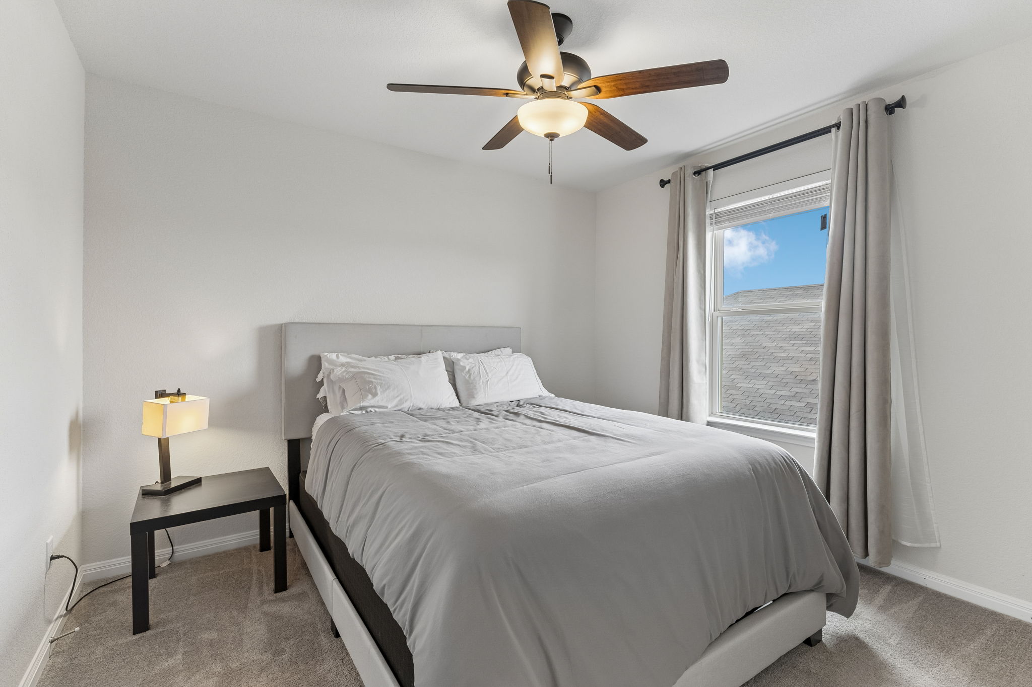 809 Whitman Avenue Georgetown, TX 78626 - Photo 25 of 35 a bedroom with a bed and a ceiling fan
