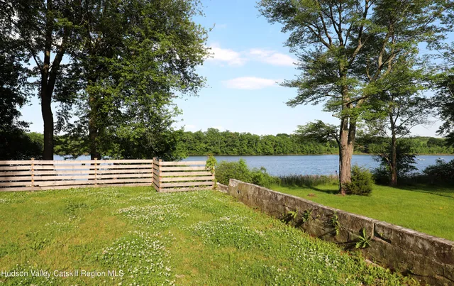 a view of a lake with a big yard