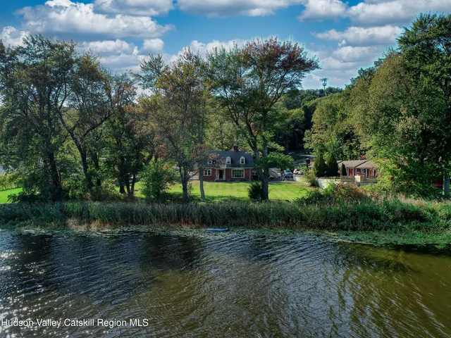 a view of a lake with a building in the background