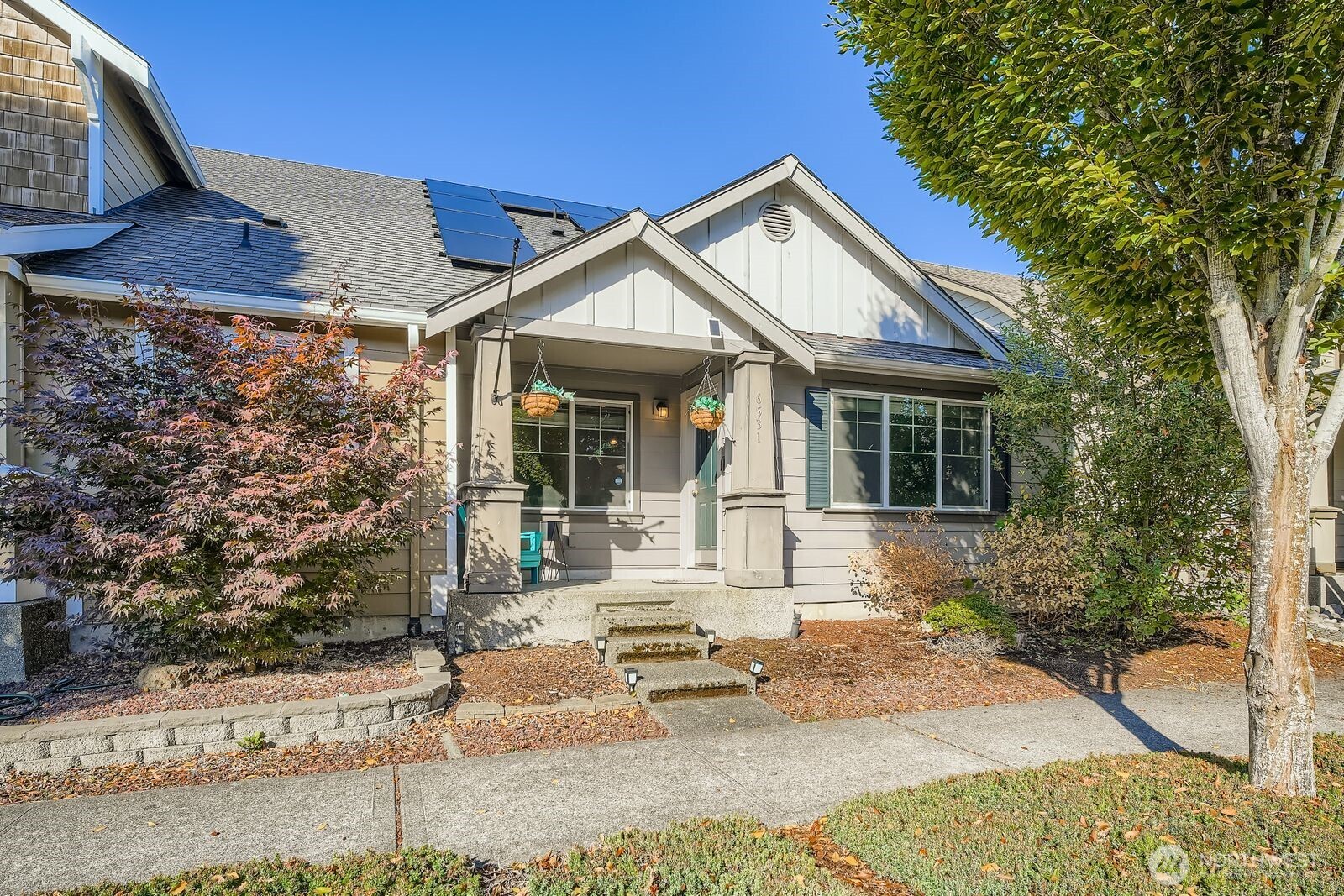 a front view of a house with garden
