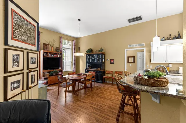 a living room with fireplace furniture and a large window