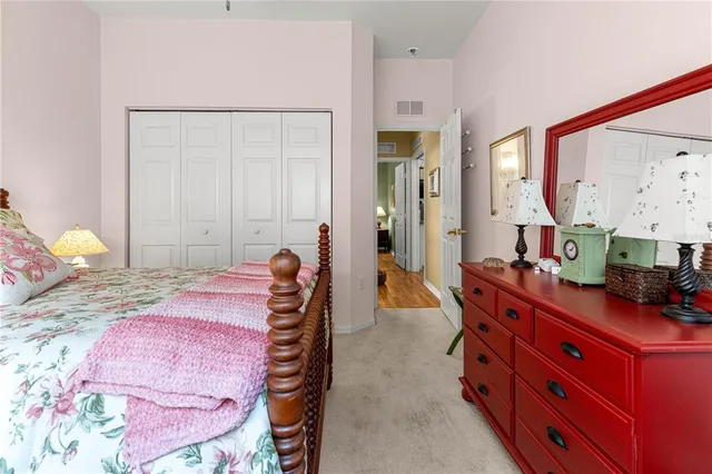 a bed room with a bed and a mirror