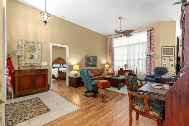 a living room with fireplace furniture and a window