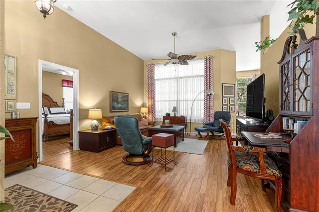 a living room with fireplace furniture and a flat screen tv