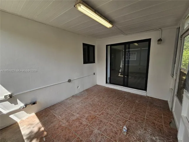 a view of a livingroom with a large window
