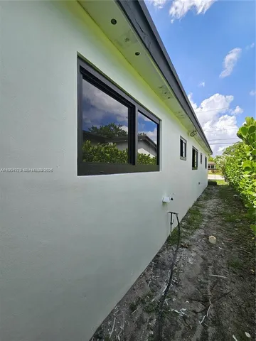a house view with a backyard