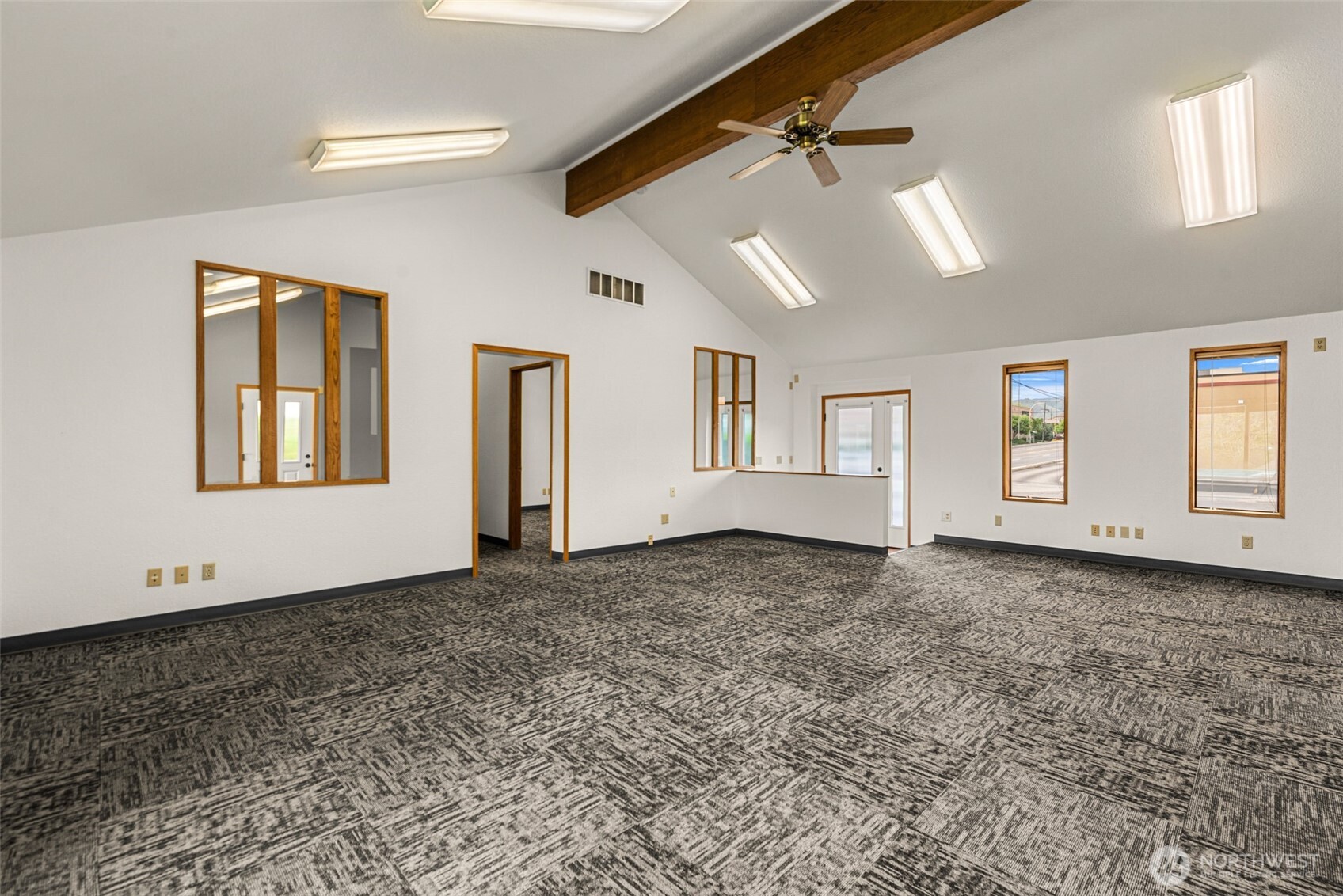 710 North Miller Street Wenatchee, WA 98801 - Photo 14 of 33 a view of a livingroom with wooden floor and a ceiling fan