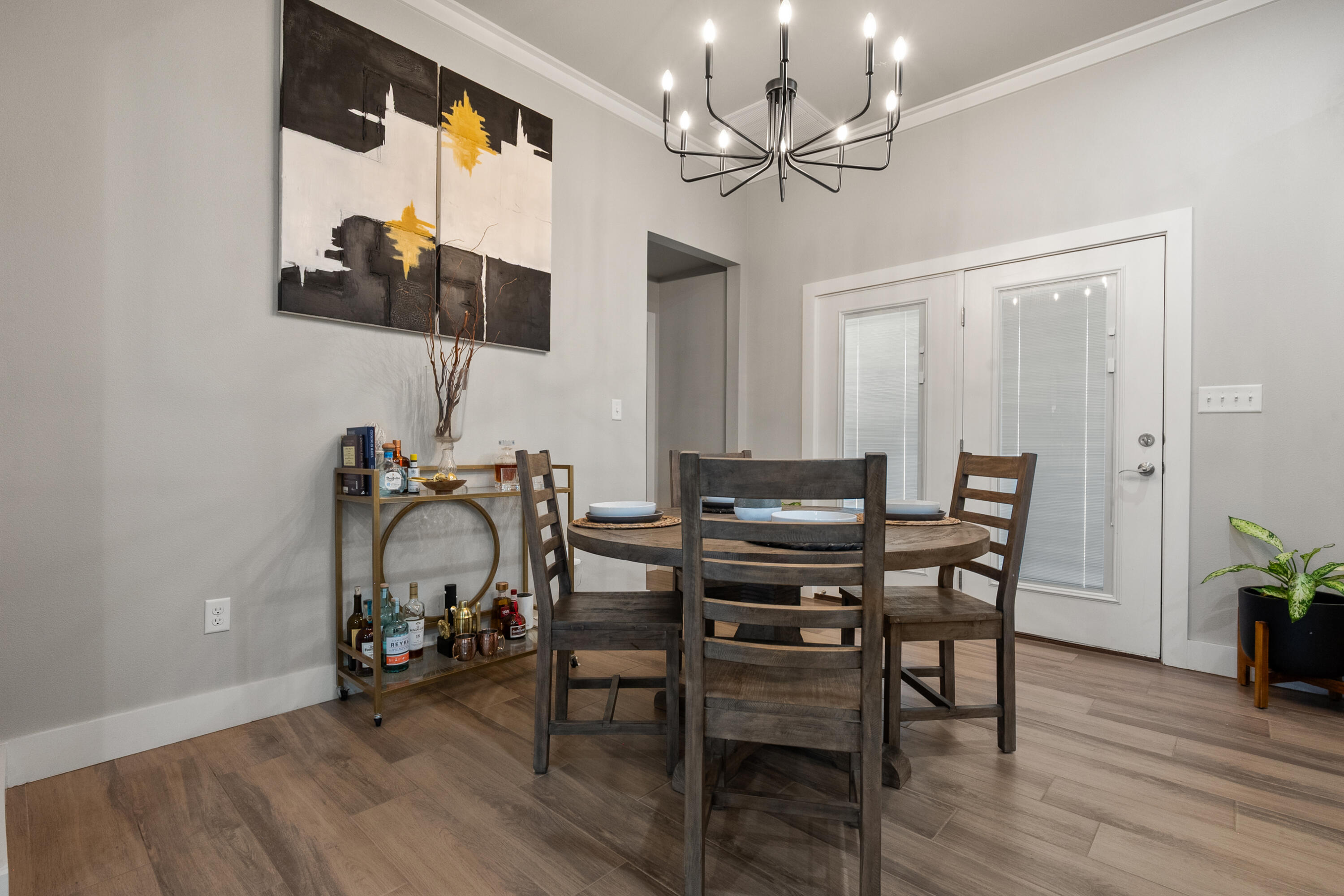 2908 137th Street Lubbock, TX 79423 - Photo 13 of 31 a view of a dining room with furniture and a chandelier