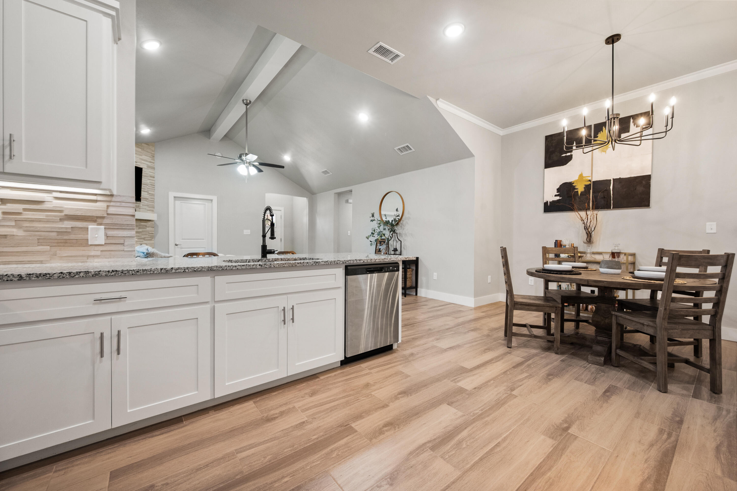 2908 137th Street Lubbock, TX 79423 - Photo 15 of 31 a large kitchen with a table and chairs in it