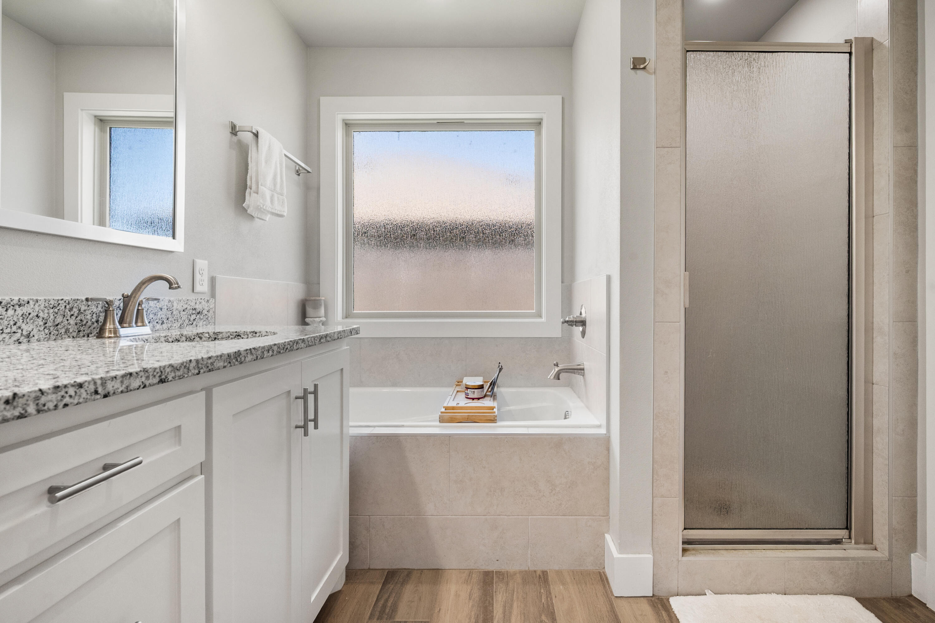 2908 137th Street Lubbock, TX 79423 - Photo 20 of 31 a bathroom with a sink and a mirror