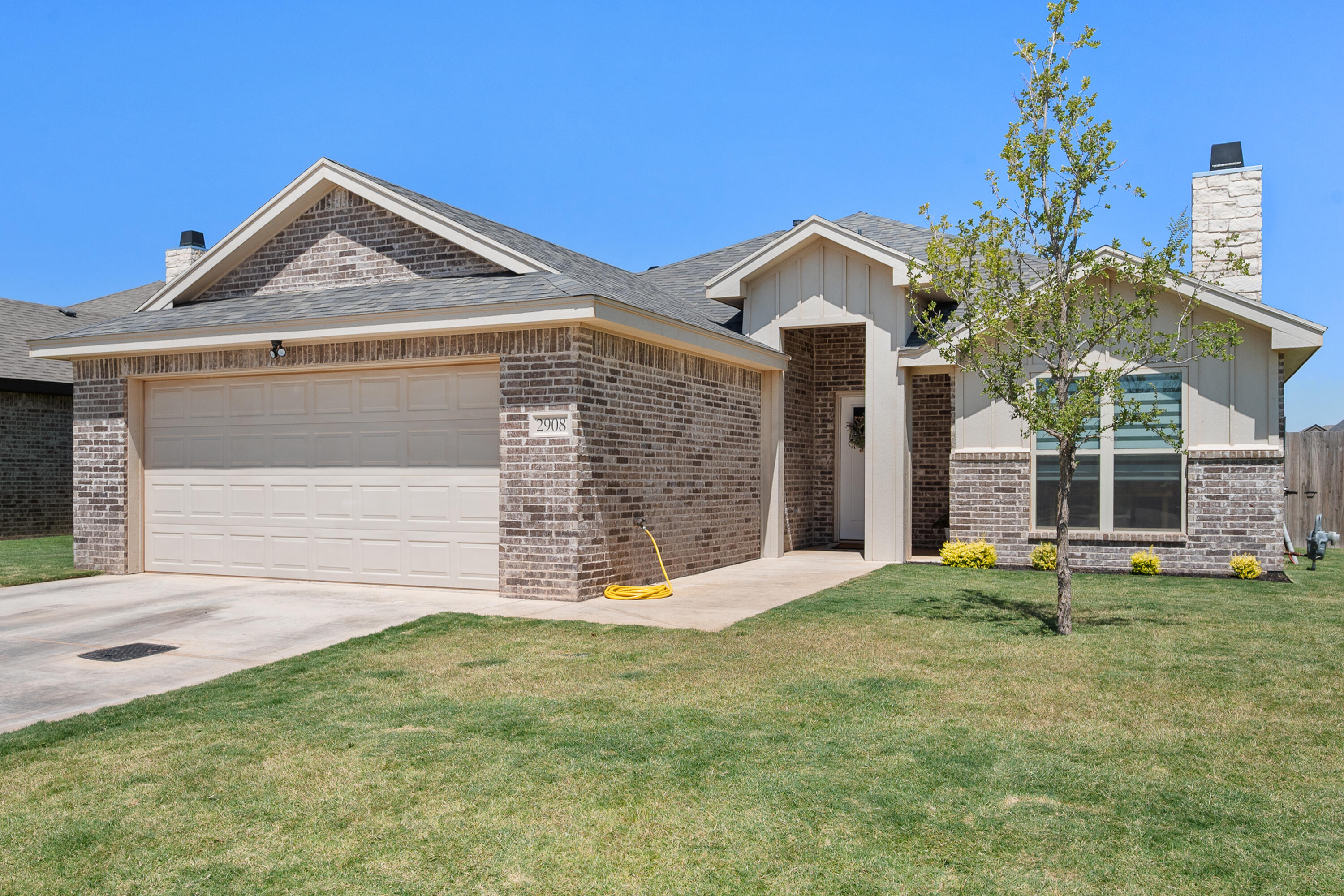 2908 137th Street Lubbock, TX 79423 - Photo 2 of 31 a front view of a house with garden
