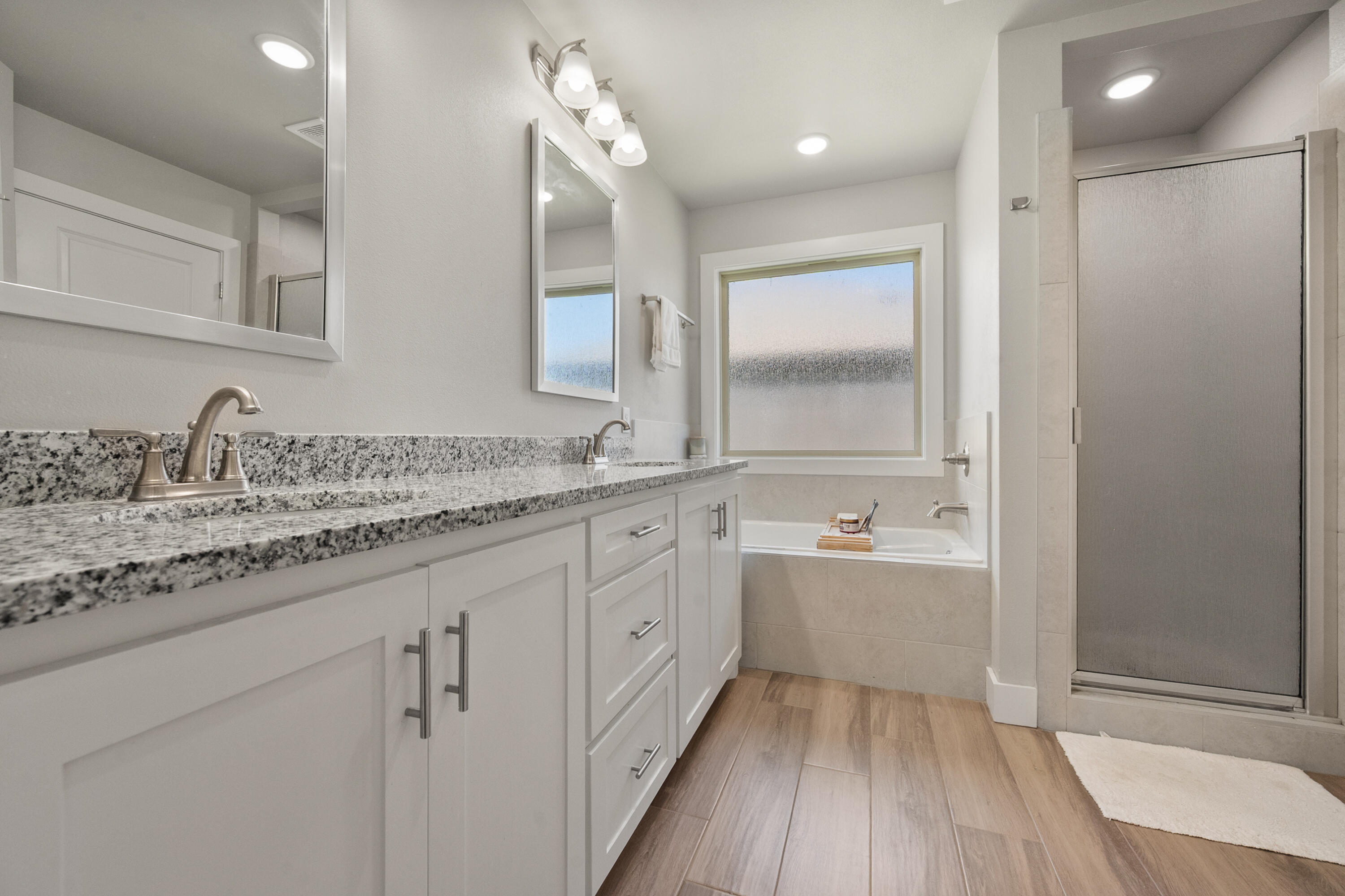 2908 137th Street Lubbock, TX 79423 - Photo 21 of 31 a bathroom with a granite countertop sink mirror and a