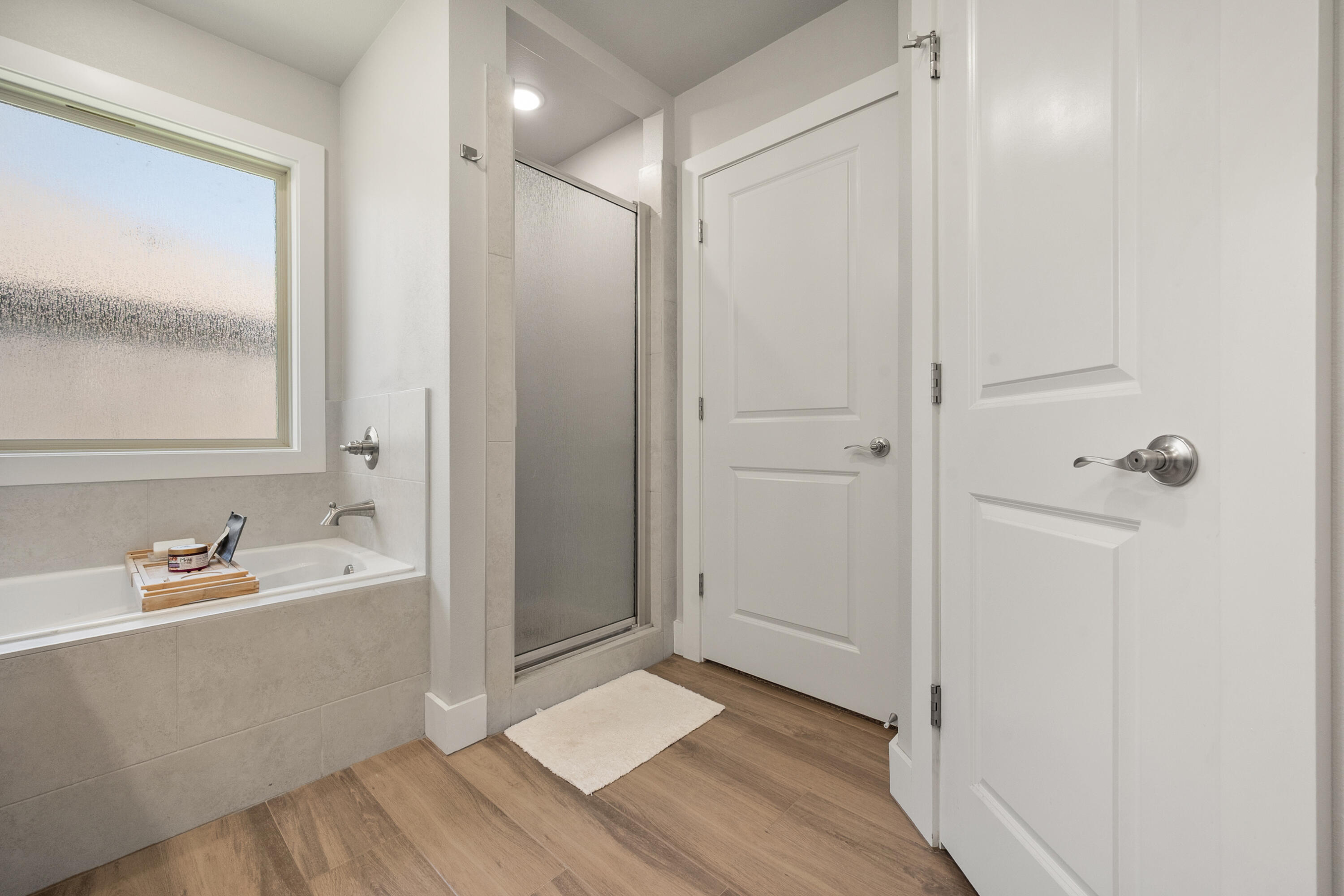 2908 137th Street Lubbock, TX 79423 - Photo 22 of 31 a bathroom with a bathtub and a sink