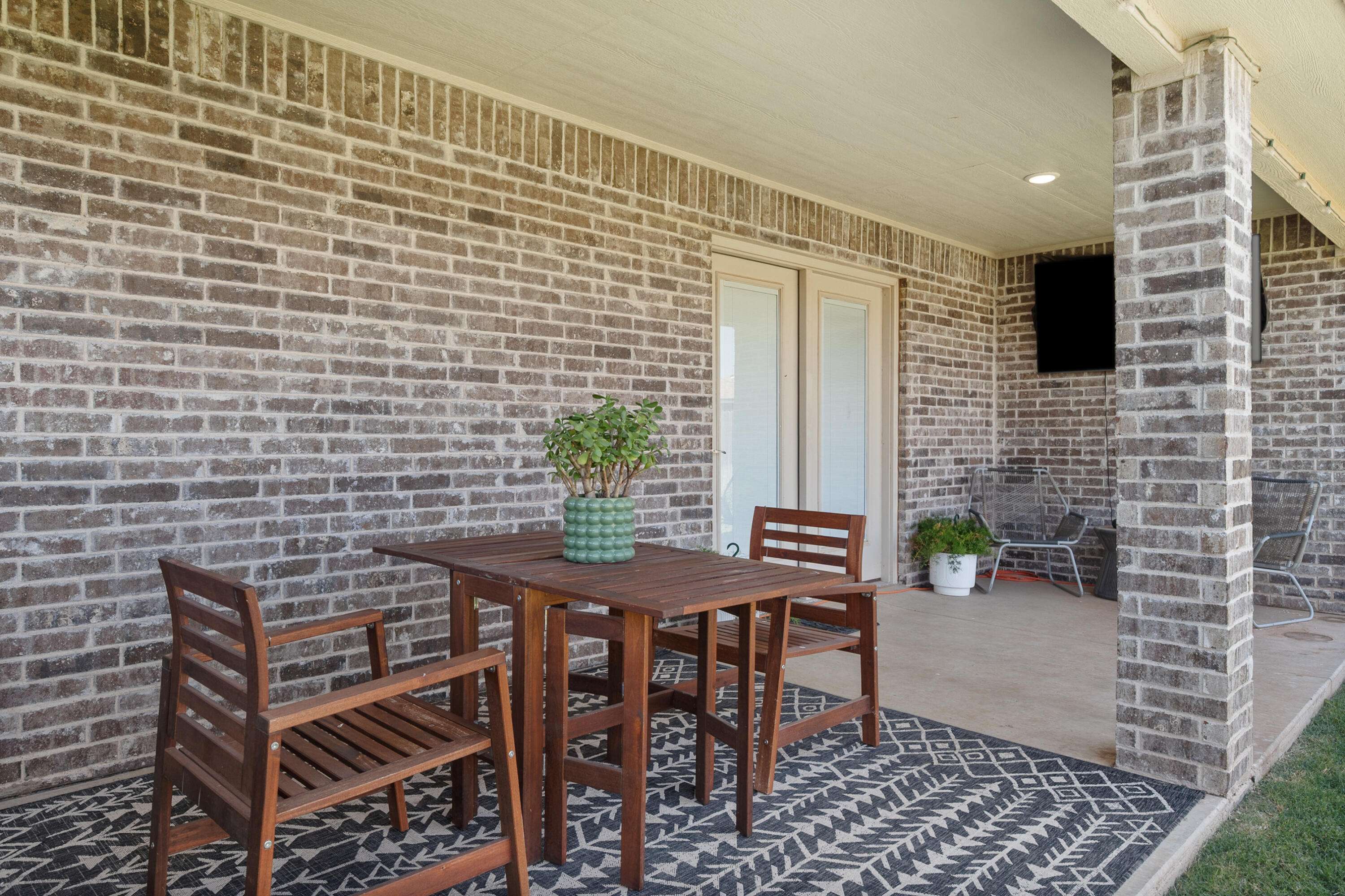 2908 137th Street Lubbock, TX 79423 - Photo 29 of 31 a view of a patio with a table and chairs