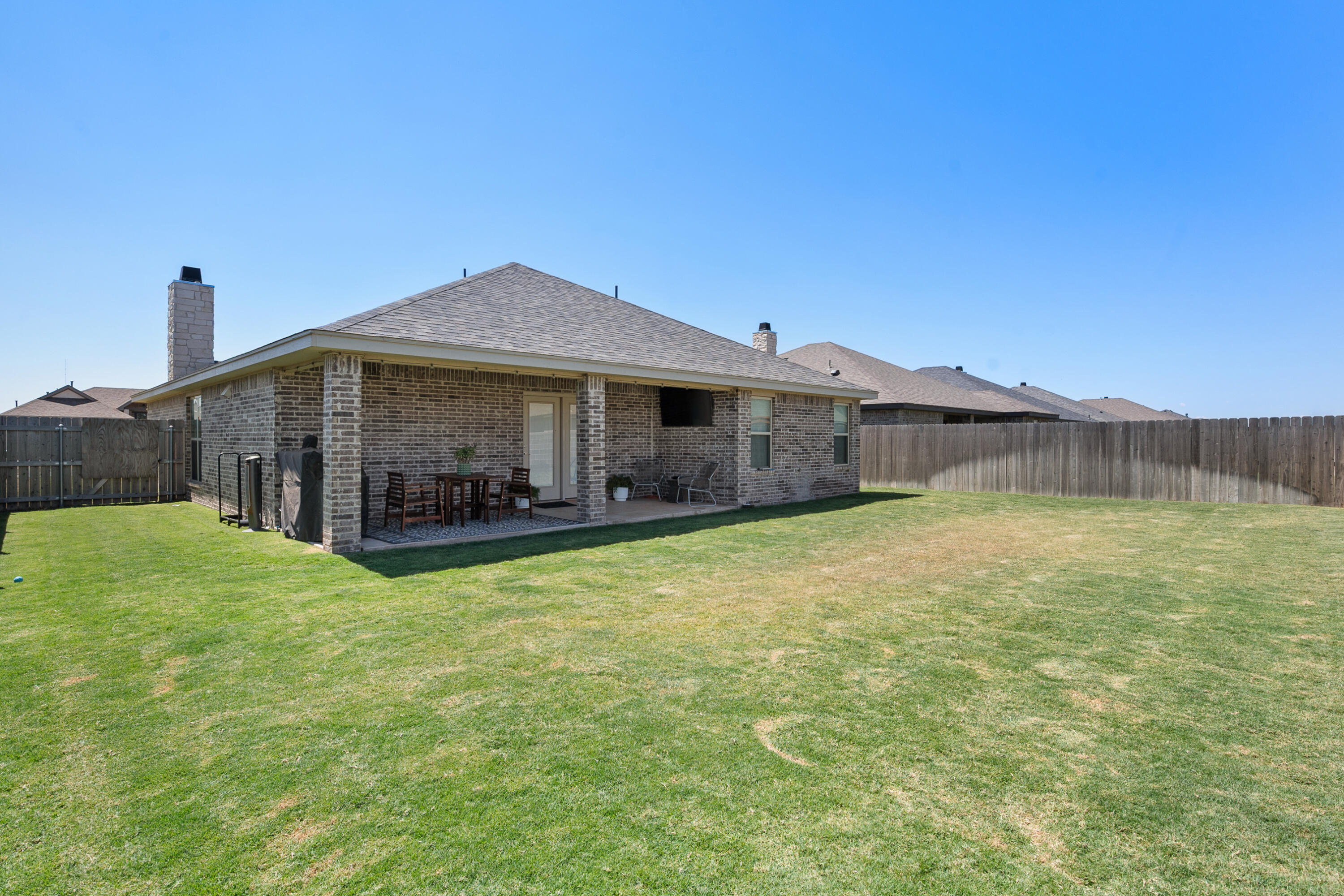 2908 137th Street Lubbock, TX 79423 - Photo 30 of 31 a view of a house with a backyard