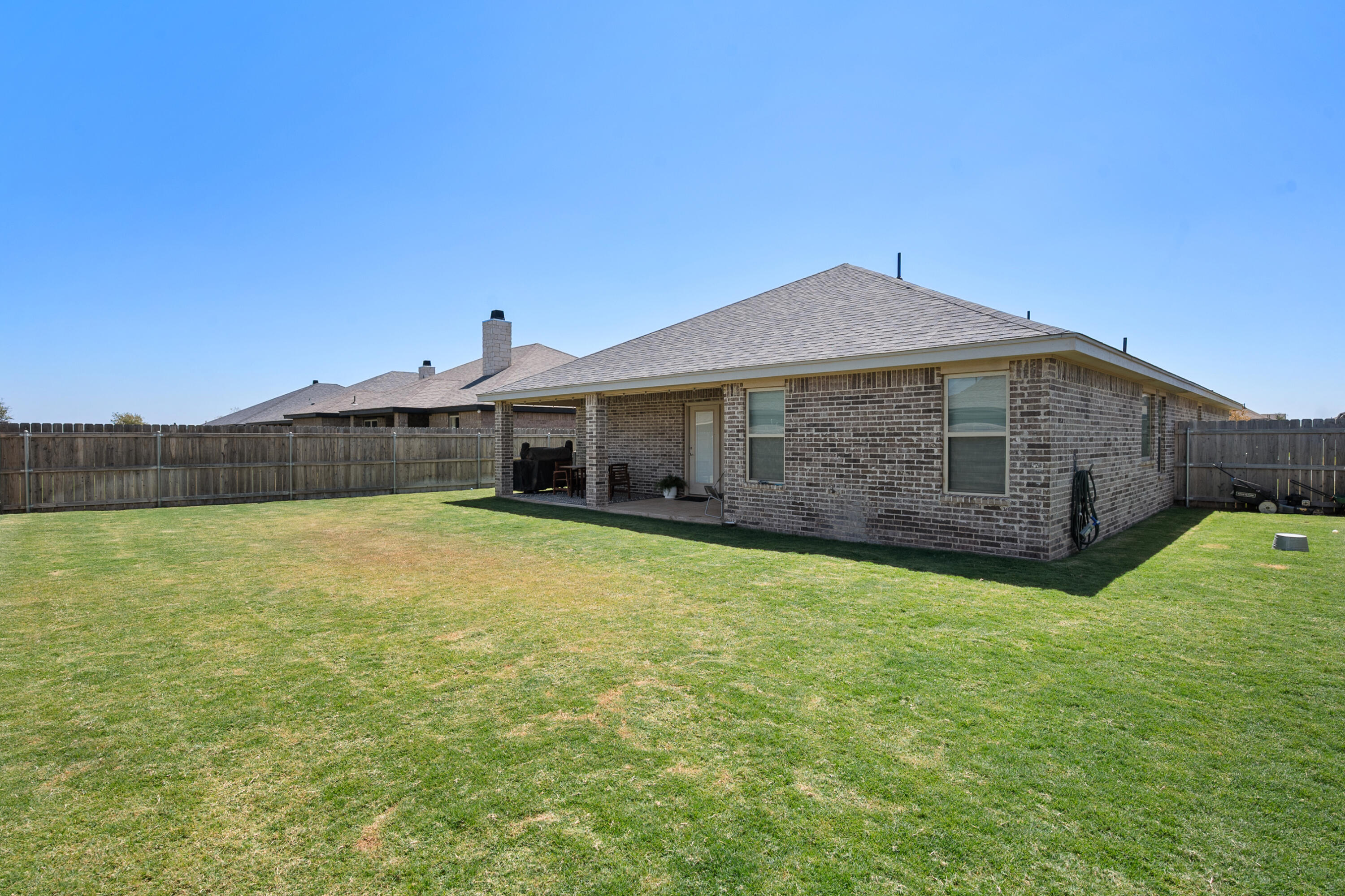 2908 137th Street Lubbock, TX 79423 - Photo 31 of 31 a front view of a house with a yard