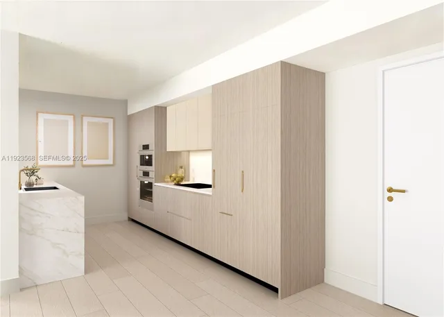 a kitchen with a refrigerator a stove top oven and cabinets