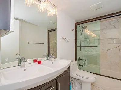 a bathroom with a sink toilet and shower