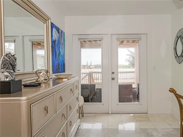 a bathroom with a double vanity sink a mirror and a bathtub
