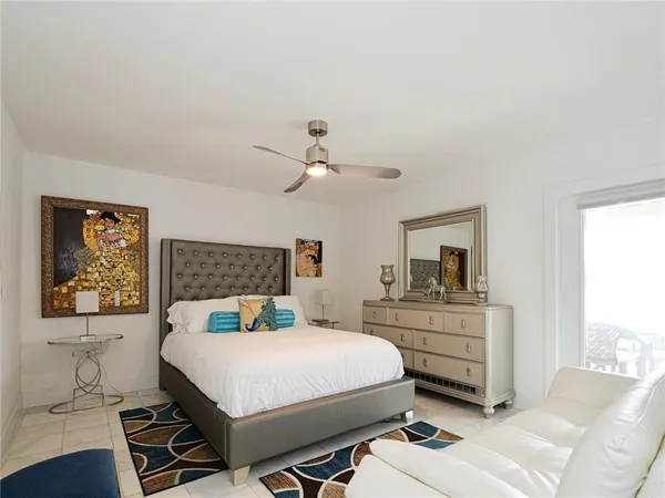 a bedroom with a bed and a desk