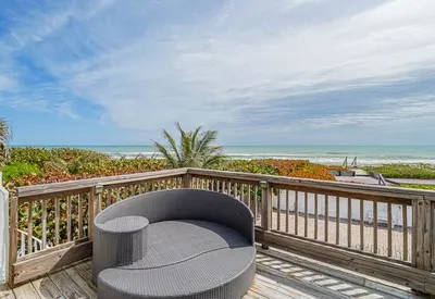 a roof deck with a table and chairs