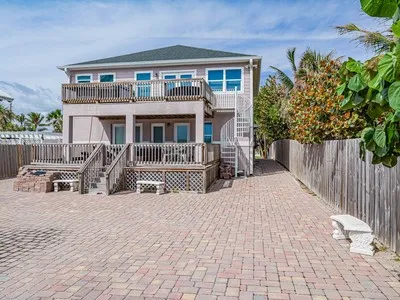 a front view of a house with glass doors
