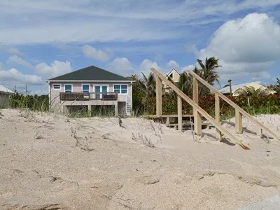 a view of a house with a snow in the background