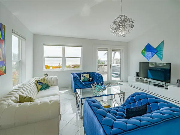 a living room with furniture flat screen tv and a fireplace
