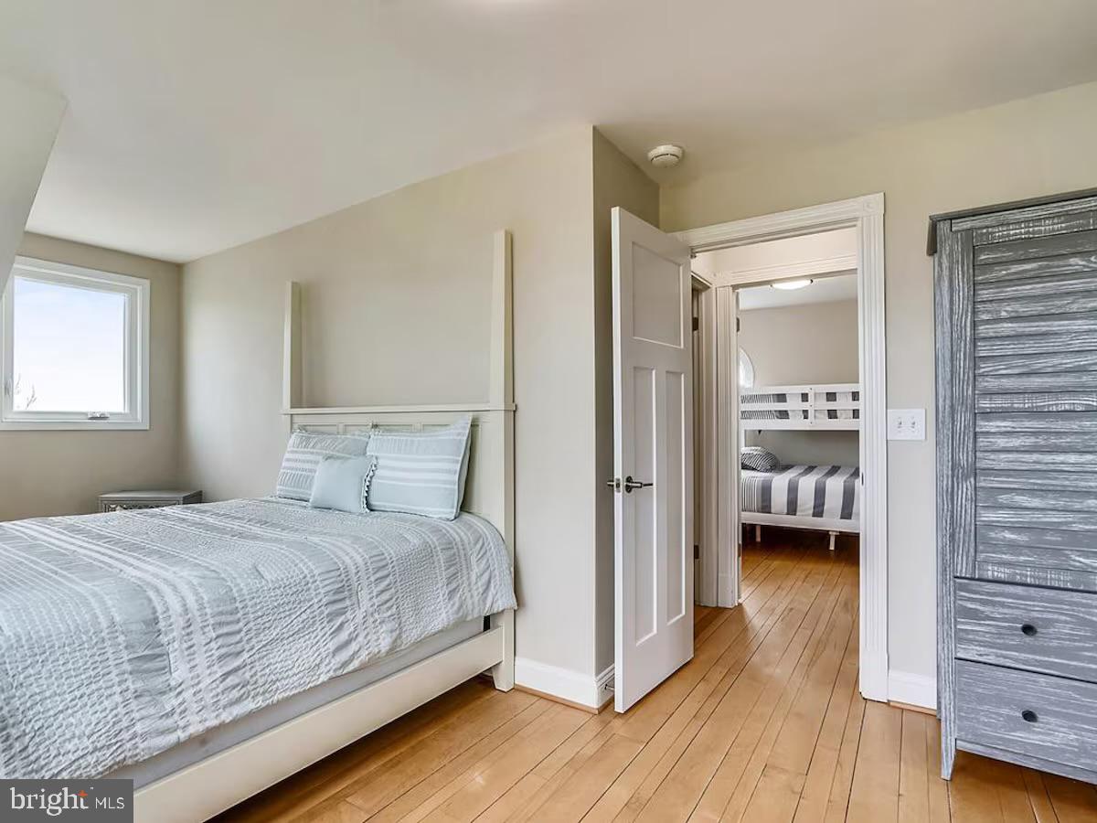 21642 Chicken Point Road Tilghman, MD 21671 - Photo 46 of 63 a bedroom with a bed and a view of bedroom